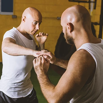 Two people practicing Krav Maga