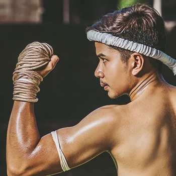 A muay thai practitioner posing for the camera