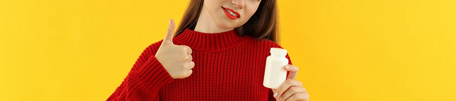 Woman giving thumbs up from a supplement product