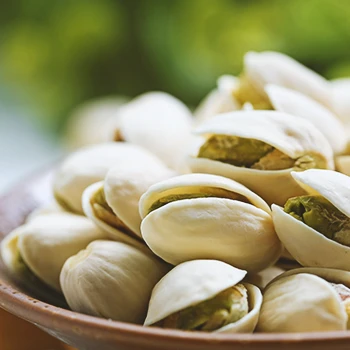 Close up shot of Pistachios on a bowl