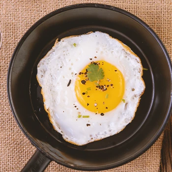 Close up shot of a fried egg on a pan