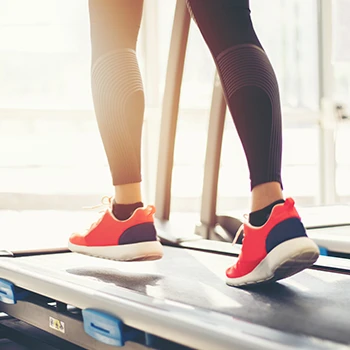 A woman on a treadmill doing cardio