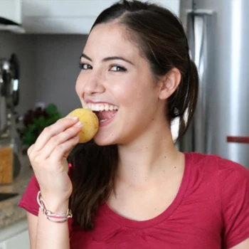 Woman eating potatoes