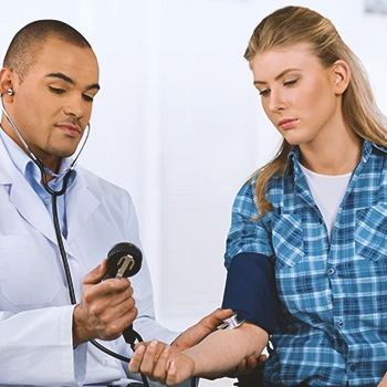 A doctor checking up on a patient in a clinic