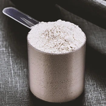 A close up shot of pre-workout powder in a scoop