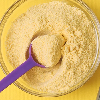 Top shot of protein powder with a scoop