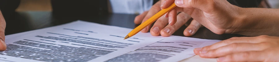 Close up shot of a lawyer pointing at paperwork