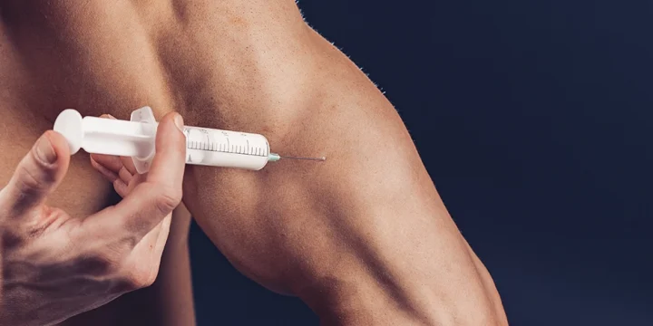 Injecting a testosterone drugs on arm