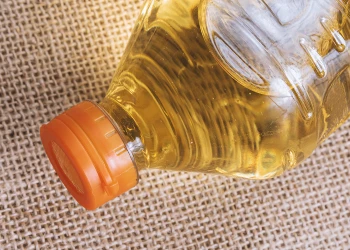 Close up shot of a bottle of oil full of cholesterol