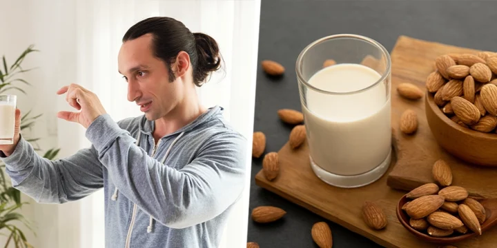 A guy holding an almond milk