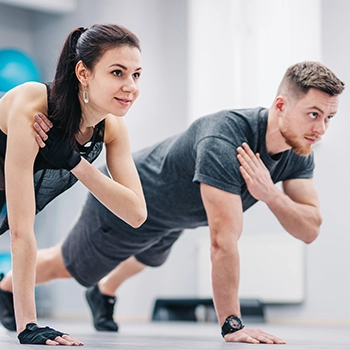 Couple exercising at the same time