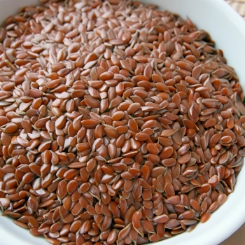 A top view of flaxseeds on a white bowl