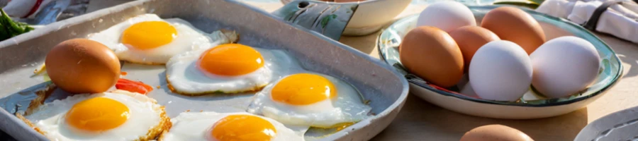 cooked sunny side up eggs on a tray