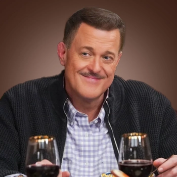Billy Gardell with a mustache in dining area