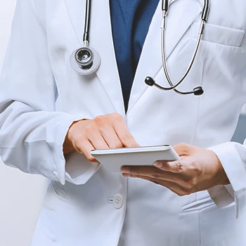 A doctor pointing to a notebook