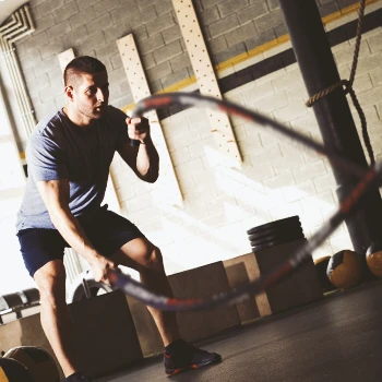 A person working out with a rope in the gym