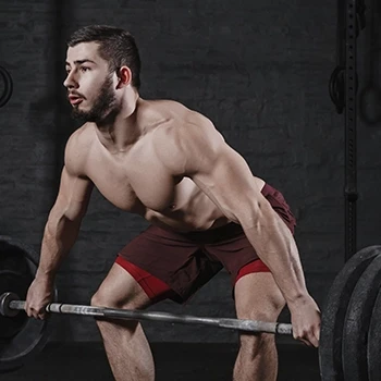 Man holding barbell, doing deadlifts