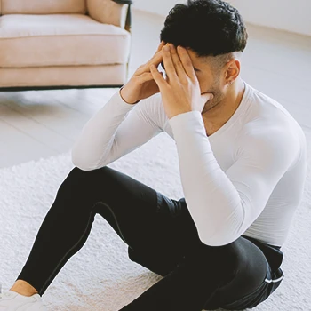 A person in workout clothes being stressed