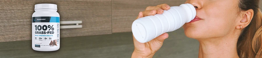 A woman drinking a protein shake with Transparent Labs Protein Powder on the side