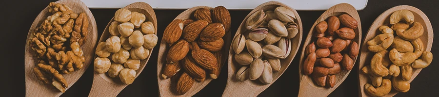 A row of different types of nuts that lower testosterone levels