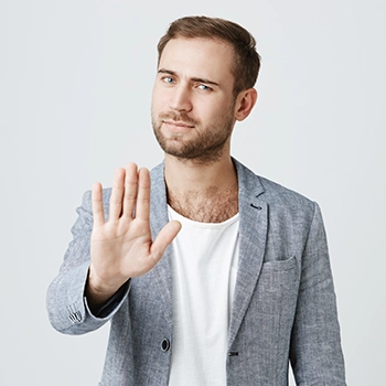 A hand gesture telling to stop or avoid