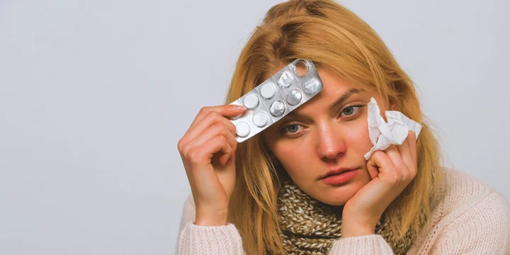 A stressed person holding nootropic pills for stress