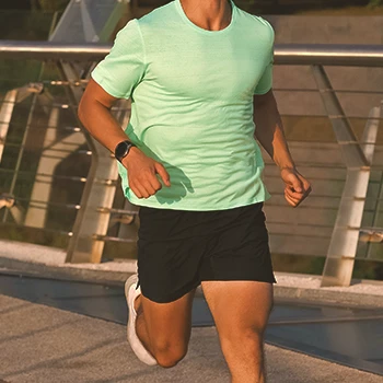 A male over 30 staying fit by jogging outside