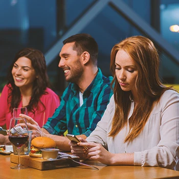 A woman being pressured by the family at dinner