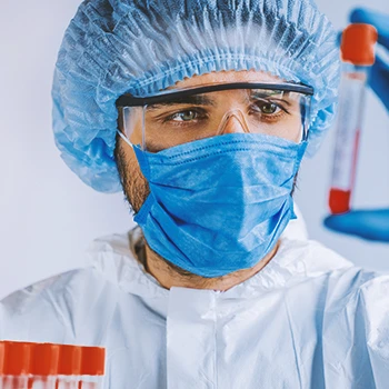 A doctor looking at a blood test in a lab