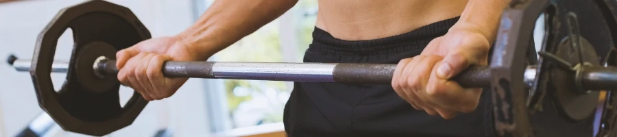 A man lifting weights at home