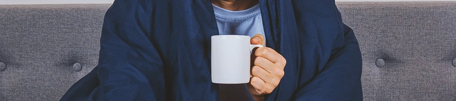 A man holding a cup of coffee