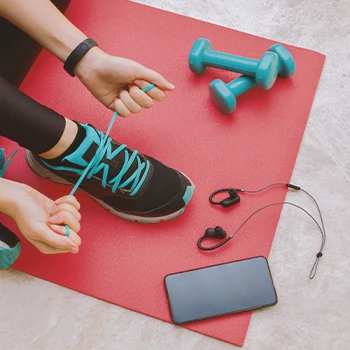 A woman tying her shoes