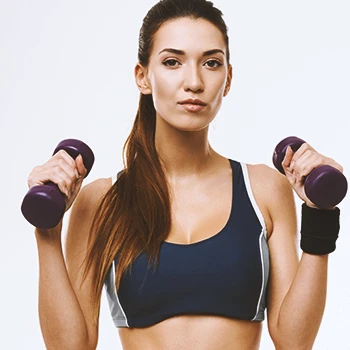 A woman holding free weights