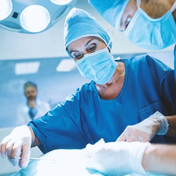 A surgeon doing plastic surgery in a hospital