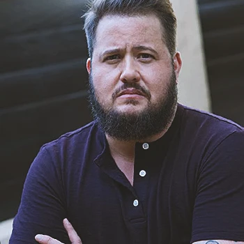 Chaz Bono fit and buff while looking at the camera