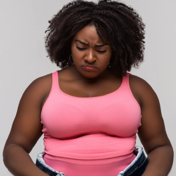 A woman wearing pink sando trying jeans