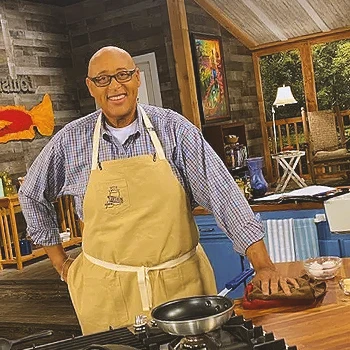 Kevin Belton cooking in a tv show