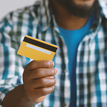 A person holding a credit card