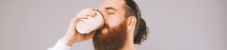 A man drinking coffee from a cup