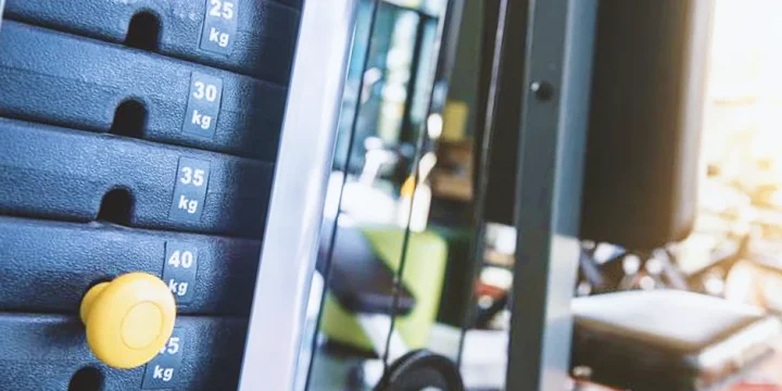 A close up shot of weight stacks inside a home gym