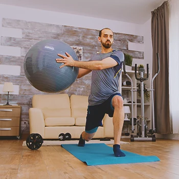 A man doing workouts at his home gym