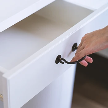 A person opening a drawer