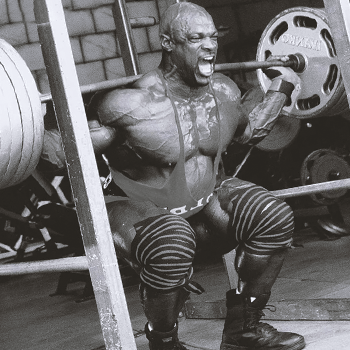 Ronnie Coleman lifting weights inside his home gym