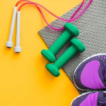 Jumping ropes, dumbbell, yoga mat and rubber shoes essential for home gym