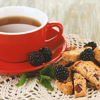 A close up shot of tea and food on a table