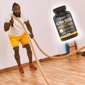 A man doing workout indoors with Alpha Brain on the side