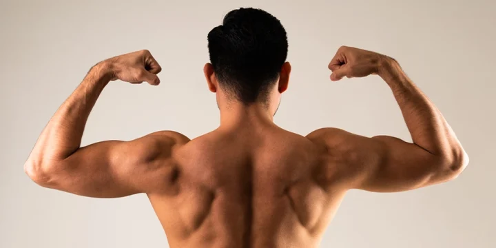 A person flexing back muscles