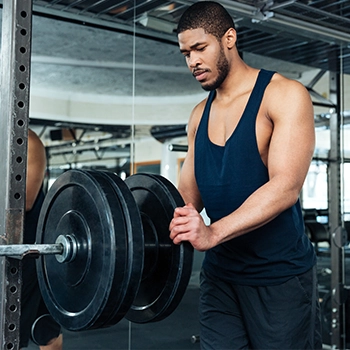 Stacking up weights on a barbell