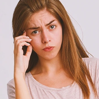 A woman pointing at her mind