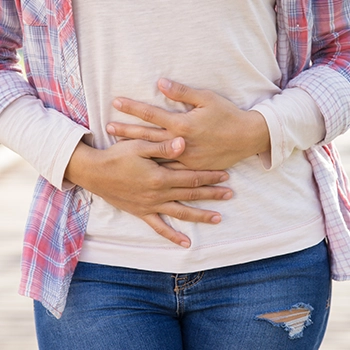 A woman with an upset stomach